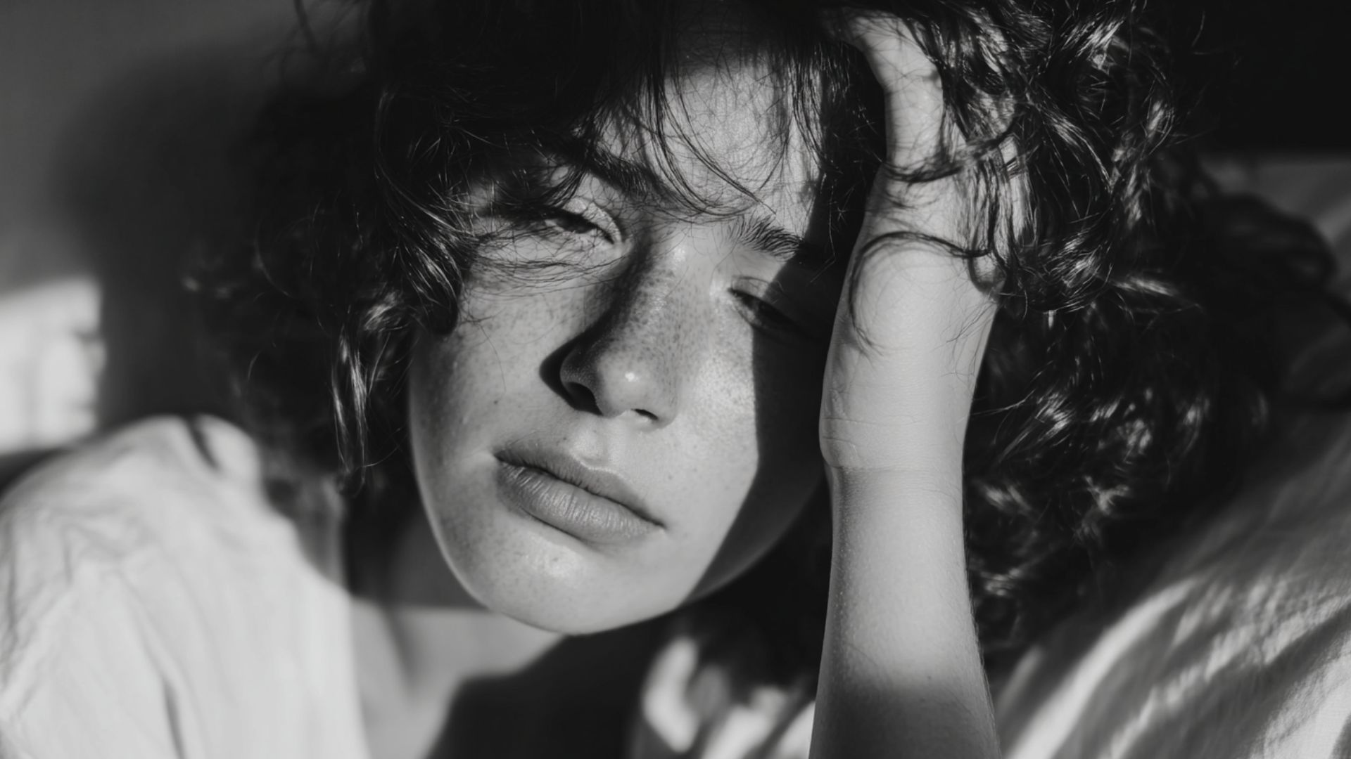 Woman with low morning cortisol waking up tired